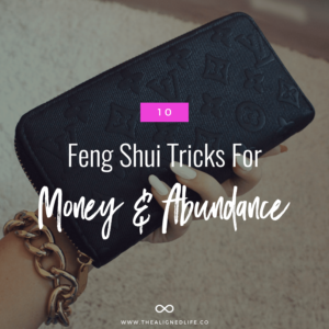 manicured hand holding wallet with text 10 Feng Shui Tricks for Money And Abundance