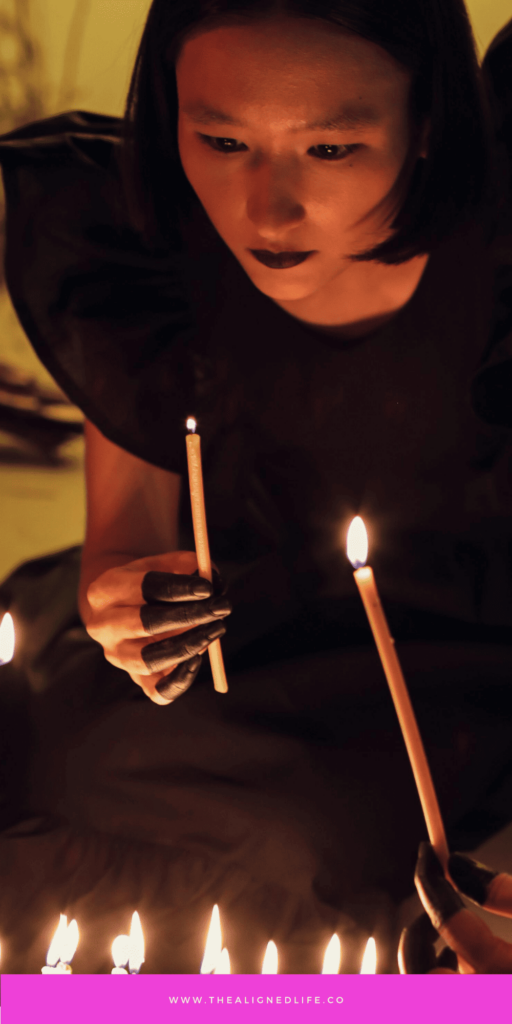 3 women with dark hair lighting candles | How To Manifest Whatever TF You Want | The Aligned Life Manifestation Blog