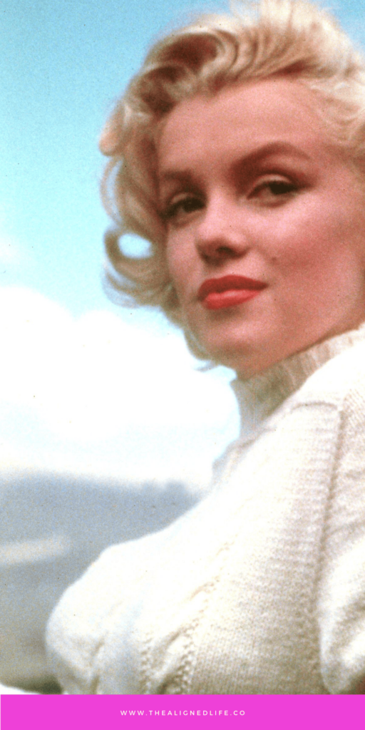 Marilyn Monroe in a white sweater | The Marilyn Monroe Manifestation Technique | The Aligned Life Manifestation Blog