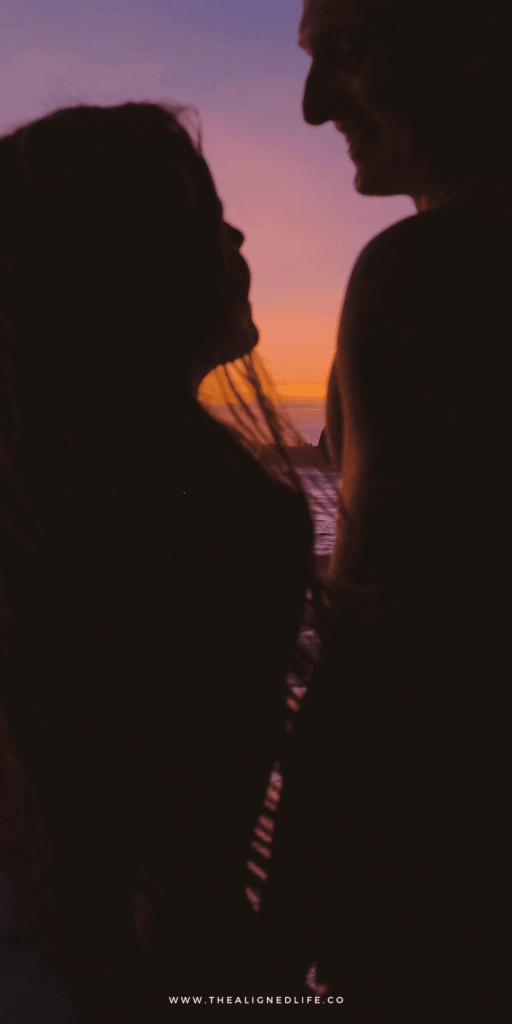 woman and man on a beach during sunset | How To Manifest Love | The Aligned Life Manifestation Blog