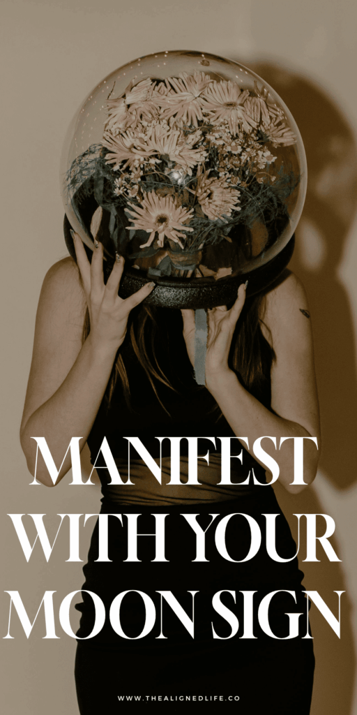 girl holding a giant globe with flowers in it | How To Manifest With Your Moon Sign | The Aligned Life Manifestation Blog