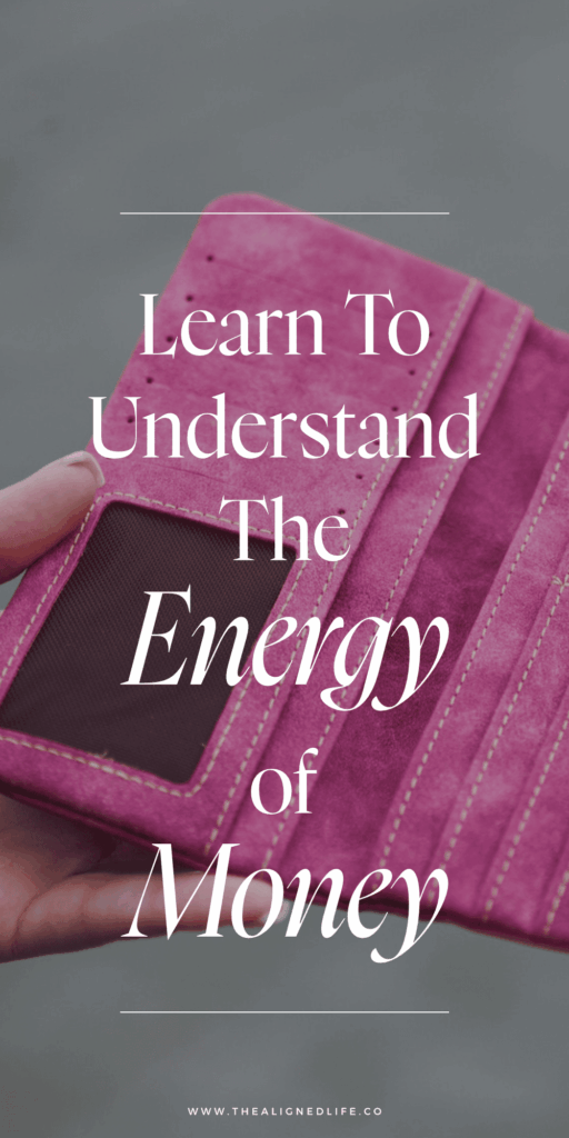 woman holding an empty pink wallet | Understand The Energy Of Money | The Aligned Life Manifestation Blog