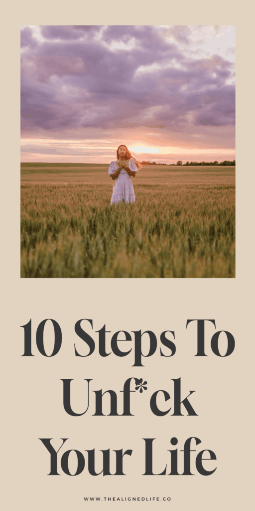 woman in a field at sunset | How To Unfuck Your Life | The Aligned Life Manifestation + Spirituality Blog
