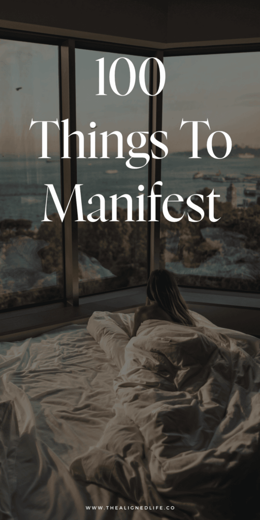 woman in a bed looking out at the beach | 100 Things To Manifest | The Aligned Life Manifestation Blog