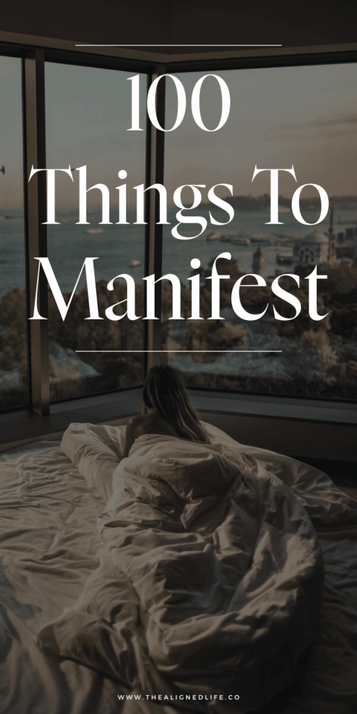 woman in a bed looking out at the beach | 100 Things To Manifest | The Aligned Life Manifestation Blog