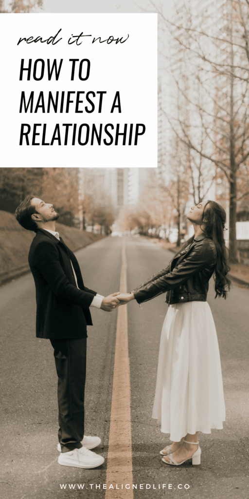 man and woman holding hands in a road with tall city buildings and trees behind them | How To Manifest A Relationship | The Aligned Life Manifestation Blog