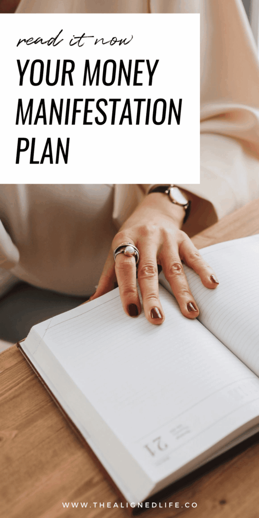 woman with her hand on a planner | Your Money Manifestation Plan | The Aligned Life Manifestation Blog