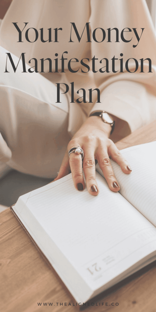 woman with her hand on a planner | Your Money Manifestation Plan | The Aligned Life Manifestation Blog