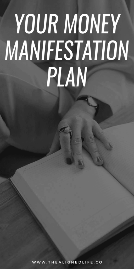 woman with her hand on a planner | Your Money Manifestation Plan | The Aligned Life Manifestation Blog