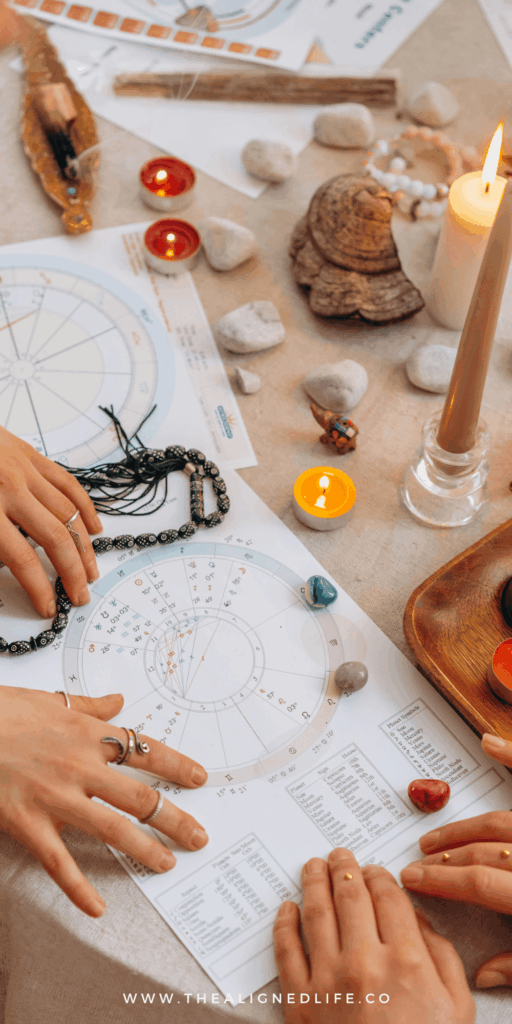 hands on an astrology birthchart with crystals | 3 Astrology Prompts for ChatGPT | The Aligned Life Manifestation + Spirituality Blog
