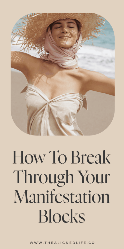 woman smiling in a straw hat on the beach | How to Break Through Your Manifestation Blocks | The Aligned Life Manifestation Blog