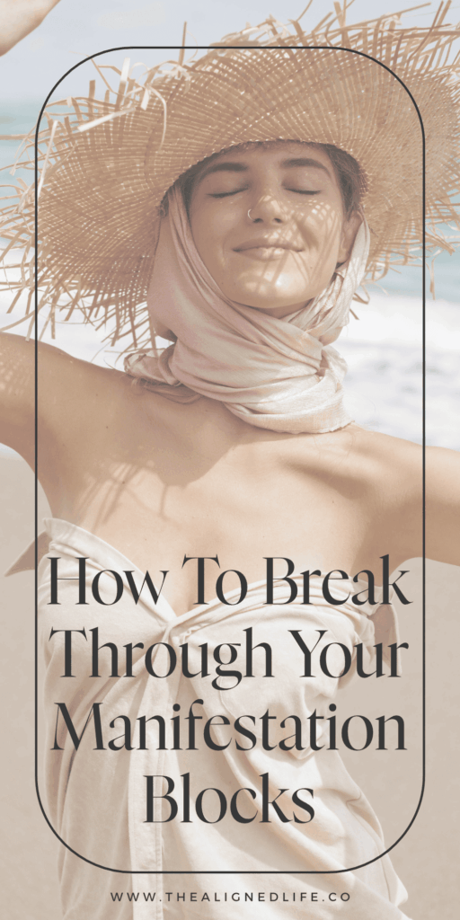 woman smiling in a straw hat on the beach | How to Break Through Your Manifestation Blocks | The Aligned Life Manifestation Blog