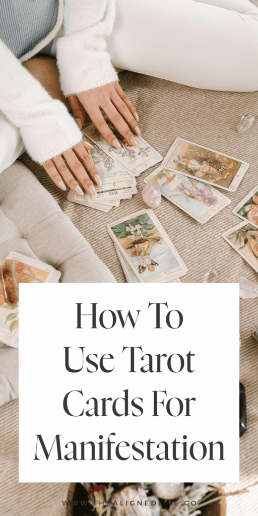 woman sitting on the floor with tarot cards and crystals | How To Use Tarot Cards For Manifestation | The Aligned Life Manifestation + Spirituality Blog