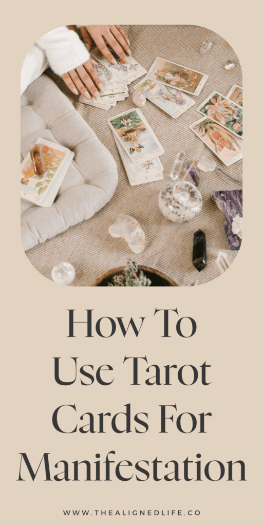 woman sitting on the floor with tarot cards and crystals | How To Use Tarot Cards For Manifestation | The Aligned Life Manifestation + Spirituality Blog