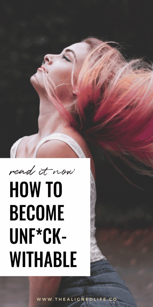 woman with pink hair in a white tank top | How To Become Unfuckwithable | The Aligned Life Manifestation Blog
