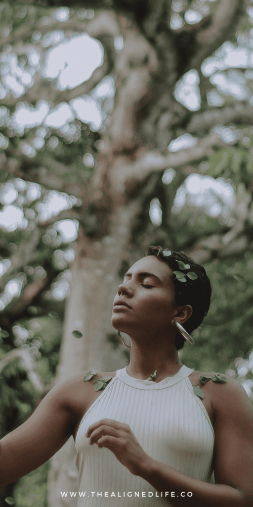 woman with her eyes closed in a forest | 3 Cord Cutting Rituals For Letting Go | The Aligned Life Manifestation Blog