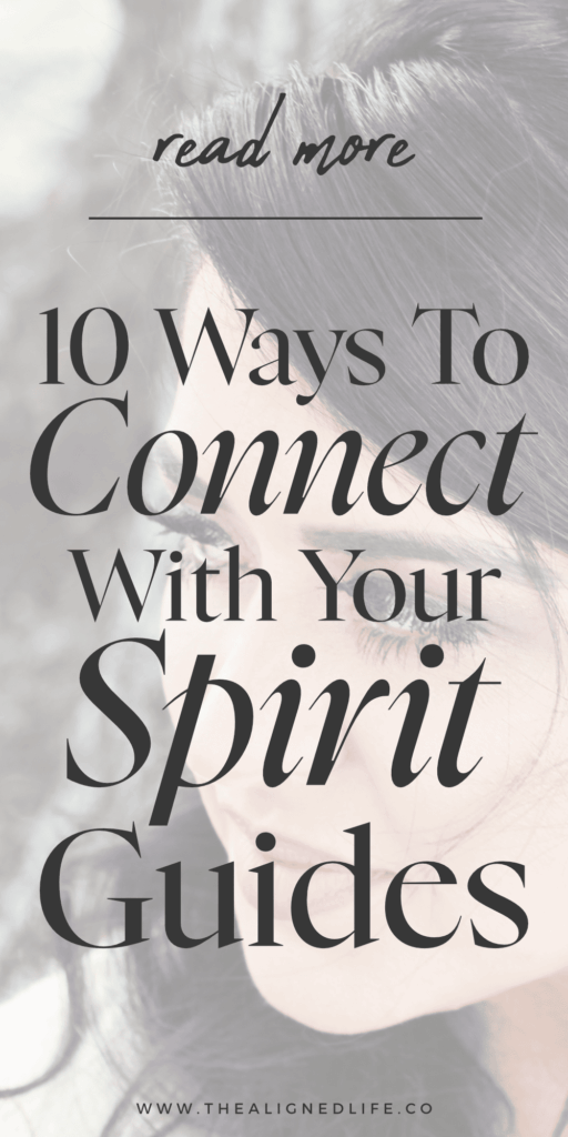 brunette woman looking over her shoulder | 10 Ways To Connect With Your Spirit Guides | The Aligned Life Manifestation Blog