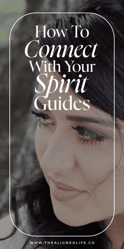 brunette woman looking over her shoulder | 10 Ways To Connect With Your Spirit Guides | The Aligned Life Manifestation Blog