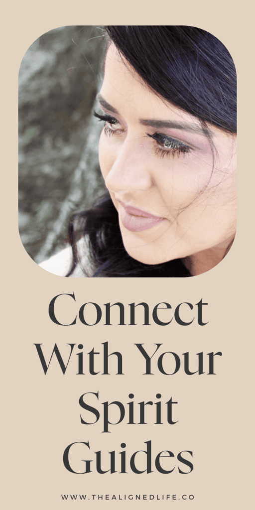 brunette woman looking over her shoulder | 10 Ways To Connect With Your Spirit Guides | The Aligned Life Manifestation Blog
