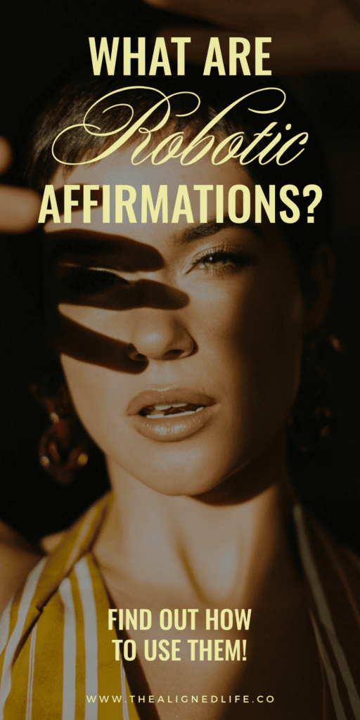 woman with her hand up | How to Use Robotic Affirmations for Manifestation