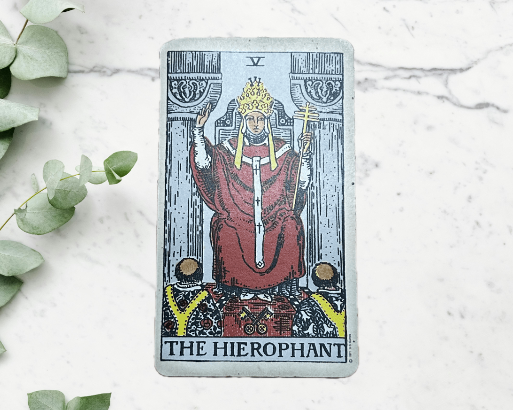 white marble table with eucalyptus & The Hierophant Tarot Card 5
