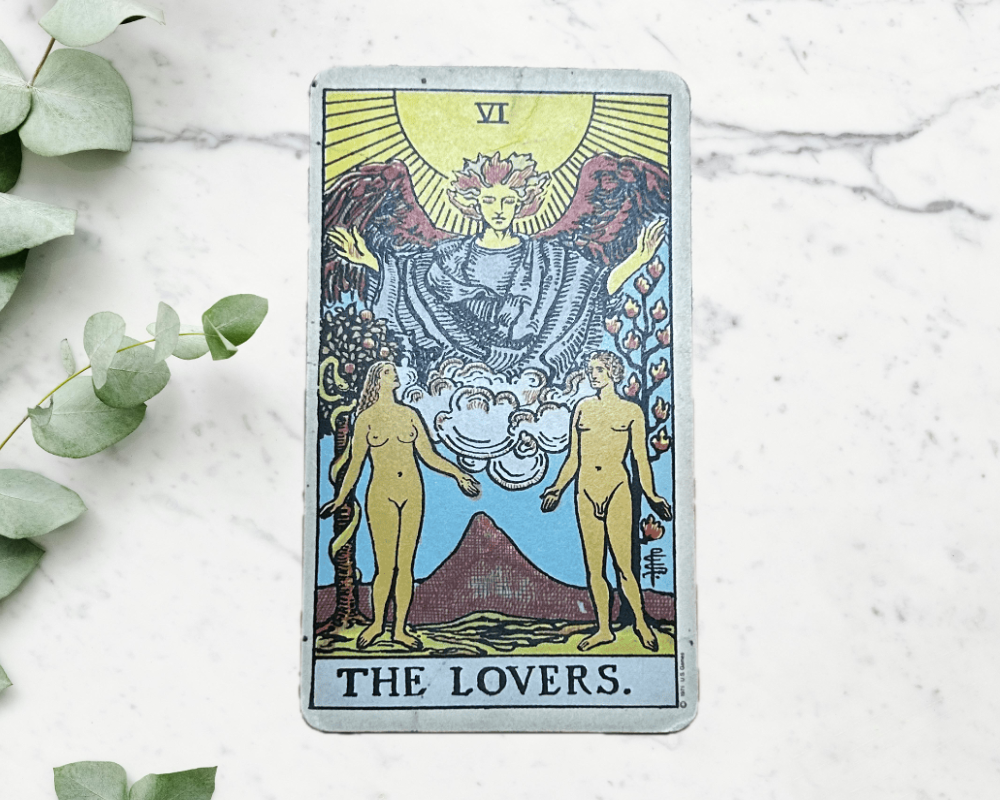 white marble table with eucalyptus & The Lovers Tarot Card 6