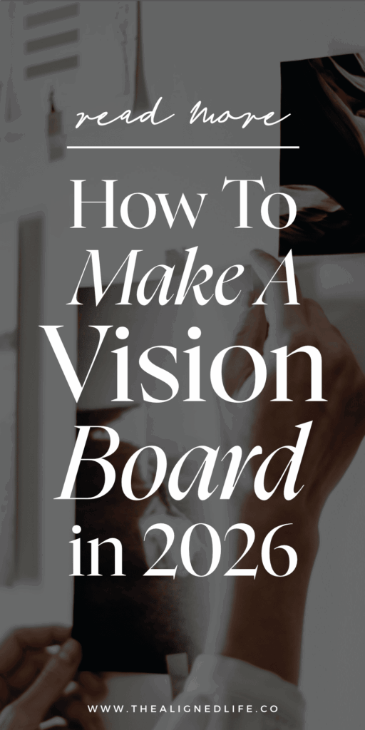 a woman's hands taping a picture to a white wall | How To Make A Vision Board In 2026 For Manifestation