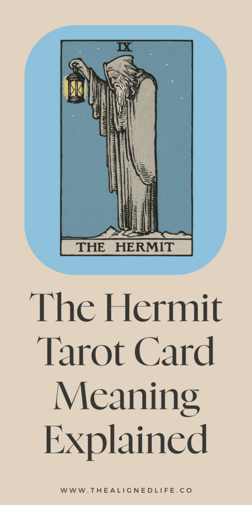 a man with a grey beard holds a lantern and a walking stick | The Hermit tarot card from the RIder Waite deck