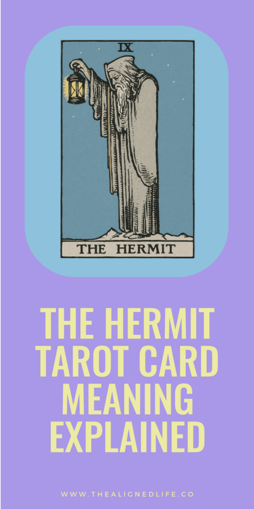 a man with a grey beard holds a lantern and a walking stick | The Hermit tarot card from the RIder Waite deck
