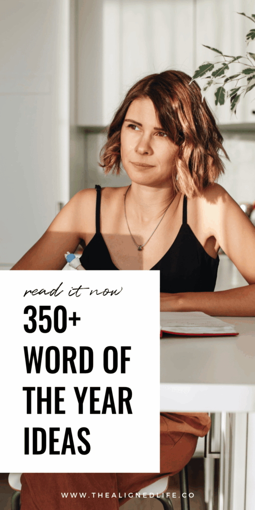 woman with a blonde bob sits at a desk with a pen in her hand | 350+ Word Of The Year Ideas