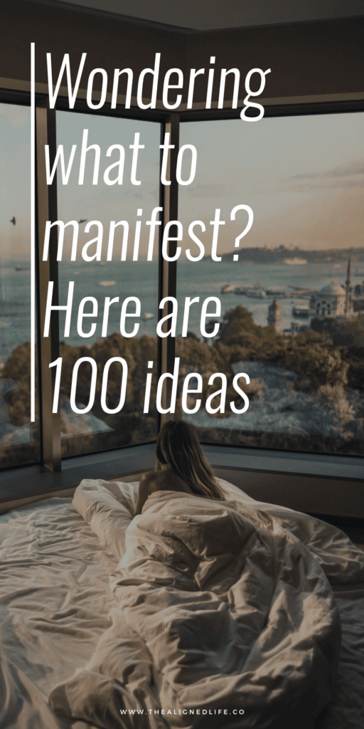 woman in a bed looking out at the beach | 100 Things To Manifest | The Aligned Life Manifestation Blog